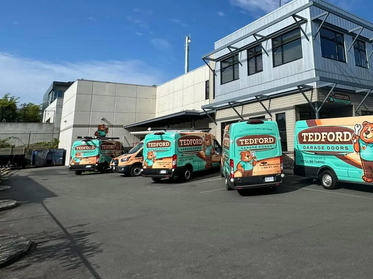 Tedford Garage Doors service vans parked outside the Victoria shop at 723B Vanalman Ave