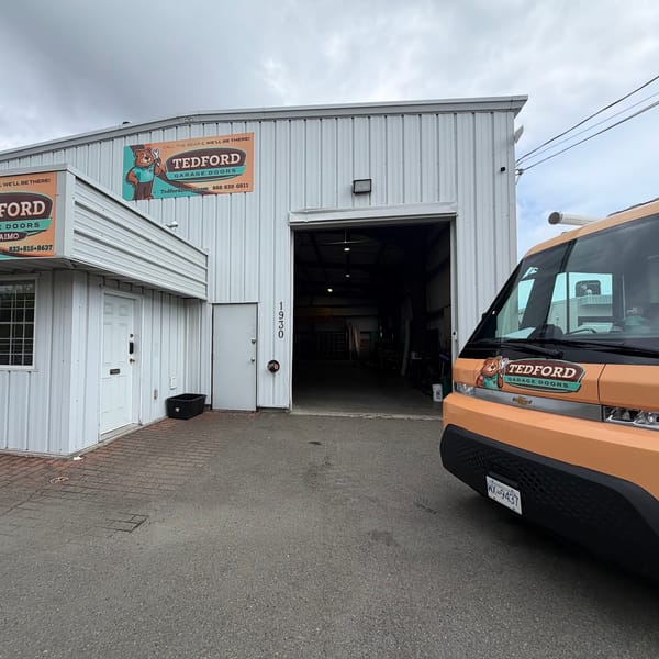 The Tedford Garage Doors Nanaimo shop on Northfield Road with a Tedford van out front
