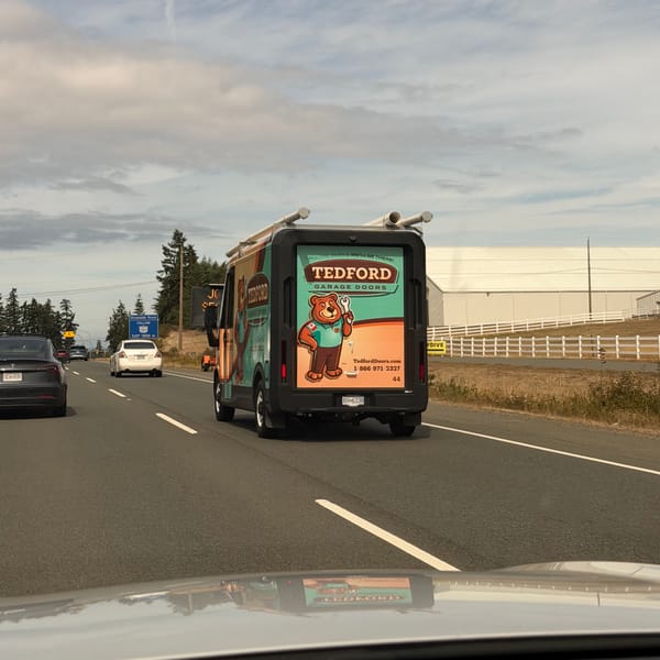 A Tedford Garage Doors service van on the highway